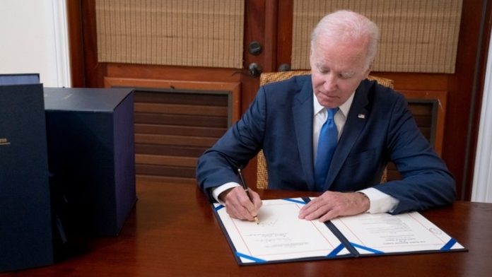 Biden signs $1.7 trillion spending bill