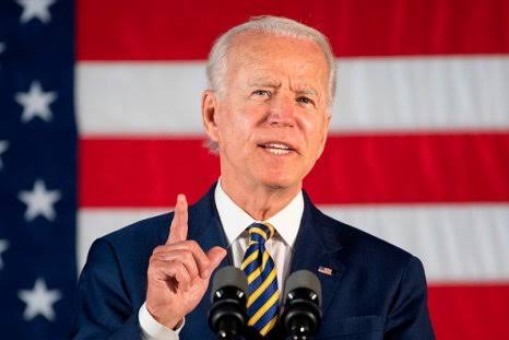 Biden virtue-signals about climate change while omnibus bill is flown to his tropical vacation spot